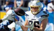  ?? AP File Photo ?? Los Angeles Chargers tight end Hunter Henry (right) makes a catch Sunday during a game against the Indianapol­is Colts in Carson, Calif. Henry will be placed on injured reserve because of a knee injury.