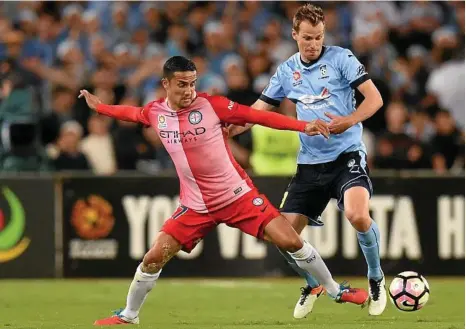  ?? PHOTO: DEAN LEWINS/AAP ?? ELITE COMPANY: Alex Wilkinson, right,does battle with Melbourne City’s Tim Cahill last week.