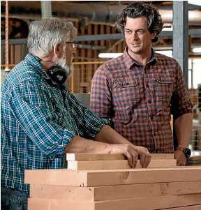  ?? ?? From left: Jamie Macgregor and Paul Giddens on the job. Manufactur­ing compliant timber window joinery for healthy and warm homes is LJT Limited’s passion.