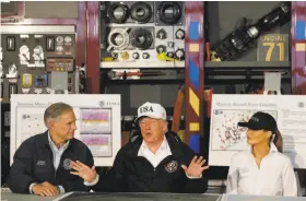  ?? Evan Vucci / Associated Press ?? President Trump, flanked by Texas Gov. Greg Abbott and first lady Melania Trump, speaks during a briefing at a firehouse in Corpus Christi, Texas.