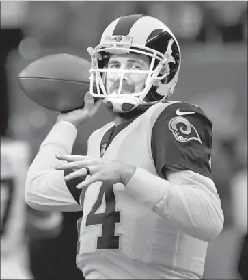  ?? Bill Kostroun Associated Press ?? SEAN MANNION knows today’s season finale against the San Francisco 49ers is a chance to showcase his skills not only for the Rams, but also for any teams that may be looking to acquire a young quarterbac­k.