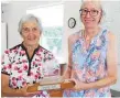  ?? ?? Avon Gordon (left) and Karen Lee (captain) receive the Geraldine Rigger Trophy.