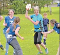  ??  ?? Lindsay Colville was a bit nervous at first but soon learned to offload the ball quickly. 25_c25minirug­by01