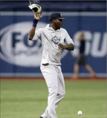  ?? CHRIS O’MEARA — THE ASSOCIATED PRESS ?? Yankees shortstop Didi Gregorius drops a ground ball while taking infield drills before a game against the Rays on Wednesday in St. Petersburg, Fla.