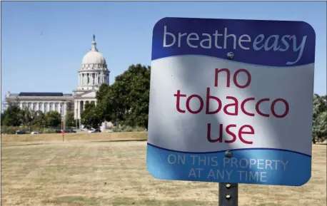  ?? SUE OGROCKI — THE ASSOCIATED PRESS FILE ?? This file photo shows a sign barring smoking at the state Capitol in Oklahoma City.