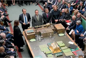  ?? AP ?? Chief Whip Julian Smith, centre left, reads out the vote count after MPs voted against a Labour Party no-confidence motion, supporting Britain’s Prime Minister Theresa May.