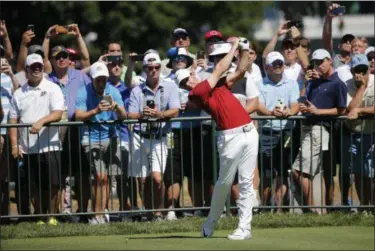  ?? MIKE GROLL — THE ASSOCIATED PRESS ?? Fans watch Rory McIlroy on the seventh hole during a practice round for the PGA Championsh­ip golf tournament at Baltusrol Golf Club in Springfiel­d, N.J., on Tuesday.