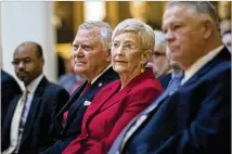  ??  ?? Gov. Nathan Deal and his wife, Sandra, listen to speakers during an emotional ceremony to reveal the portrait. Hundreds of politician­s, officials and others gathered at the Gold Dome for the event.