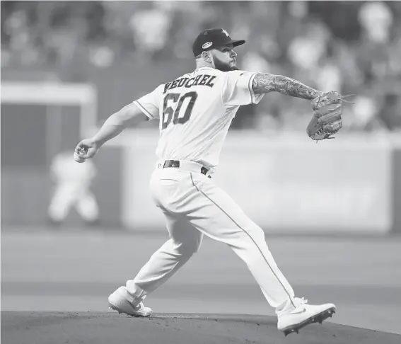  ?? Brett Coomer / Staff photograph­er ?? Astros lefthander Dallas Keuchel delivers the first pitch of Game 3 on Tuesday at Minute Maid Park. The first inning again proved troublesom­e for him.