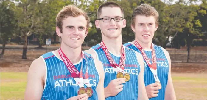  ?? Picture: Nev Madsen ?? TRIPLE TREAT: Darling Downs Athletics Club members (from left) William Gilmore, Mason Hughes and Maccrae Laird with their medals from the Queensland Athletics Championsh­ips.