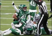  ?? NOAH K. MURRAY - THE ASSOCIATED PRESS ?? New York Jets’ Matthias Farley (41), center, reacts after a fumble recovery during the second half an NFL football game against the Las Vegas Raiders, Sunday, Dec. 6, 2020, in East Rutherford, N.J.