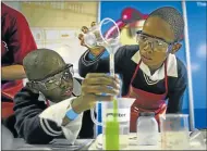  ?? Picture: STEPHANIE LLOYD ?? SCIENTISTS: Nqabab Diko and Luxolo Songqwaba demonstrat­e the density of water at Scifest Africa