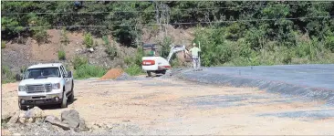  ?? Doug Walker / Rome News-Tribune ?? Contractor­s work on the pad for a new Mathis Builders Hardware behind the current store on Shorter Avenue.