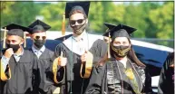  ?? Ned Gerard / Hearst Connecticu­t Media file photo ?? Members of the Jonathan Law High School Class of 2021 enter their graduation ceremony in Milford on June 15.