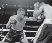  ?? ERIC RISBERG/ASSOCIATED PRESS ?? Andre Ward, left, punches Alexander Brand in August. Ward puts his undefeated record on the line Saturday.