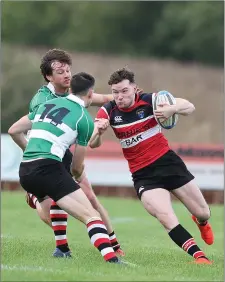  ??  ?? Dean Leonard of Wicklow tries to get past Ivan Jacob of Enniscorth­y.