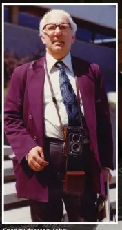  ??  ?? Snappy dresser: John Walsh in June 1975 with his trusty camera