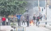  ?? REUTERS FILE ?? ■ Kashmiris throw stones on security forces during curbs after the scrapping of the special status for J&K on August 10.
