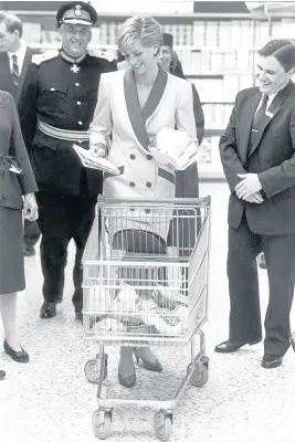  ??  ?? Princess Diana, The Princess of Wales, takes a shopping trolley around Tesco at Southport, in 1990, where she shared advice on healthy eating