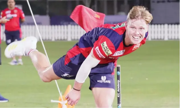  ??  ?? ↑
Punjab Kings’ bowler Nathan Ellis attends a training session ahead of their match against Rajasthan Royals.