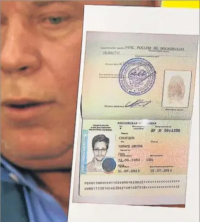  ?? AP ?? El abogado Anatoli Kucherena muestra el documento que permite a Snowden entrar en Rusia