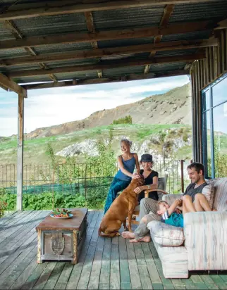  ??  ?? THESE PAGES, CLOCKWISE: Raymond and Sue say they feel lucky to be able to raise their children Luka and Esther (with Lucy the dog) in such a special place. The sun- drenched deck of their home looks out over a lush vegetable garden – paradise for...