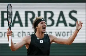  ?? THIBAULT CAMUS — THE ASSOCIATED PRESS ?? Alexander Zverev celebrates as he defeats Carlos Alcaraz during their quarterfin­al match in the French Open at Roland Garros stadium May 31in Paris.