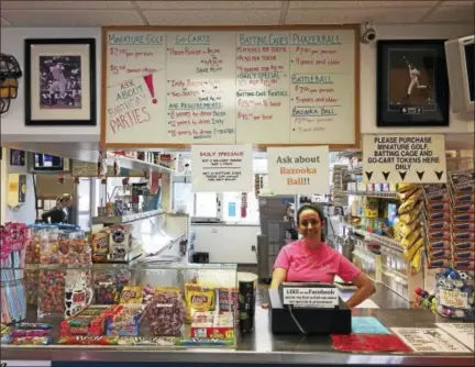  ?? BEN LAMBERT — THE REGISTER CITIZEN ?? Rachel Gagnon stands behind the counter at R&B Sports World in Winsted Wednesday afternoon.