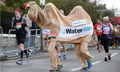  ?? Photograph: Oliver Dixon/REX/Shuttersto­ck ?? Runners, including two dressed as a camel, take part in the 2016 London Marathon. This year ‘there will be no spectators; the competitor­s – all elite athletes – will number tens rather than tens of thousands; and camels are not invited’.
