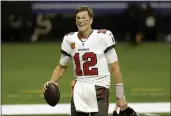  ?? BRETT DUKE — THE ASSOCIATED PRESS, FILE ?? Quarterbac­k Tom Brady, above, has agreed to a contract extension with the Buccaneers that provides the Super Bowl champions with much-needed salary cap relief and will help the seven-time NFL champion reach a goal of playing until he’s at least 45.