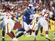  ?? Terrance Williams / Associated Press ?? New York Giants defensive tackle Dexter Lawrence (97) in action during the first half against the Washington Football Team on Thursday.