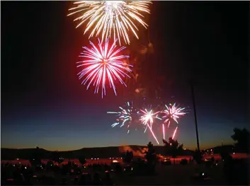  ?? EMILY BERTOLINO — ENTERPRISE-RECORD FILE ?? Fourth of July fireworks sparkle over the Thermalito Forebay in 2017 in Oroville, but this year’s display will be at the Oroville Airport.