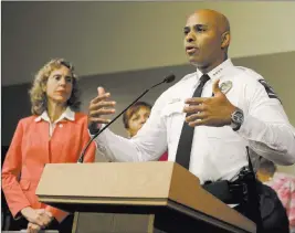  ?? CHUCK BURTON/ THE ASSOCIATED PRESS ?? Charlotte-Mecklenbur­g Police Chief Kerr Putney, right, speaks Friday as Mayor Jennifer Roberts, left, watches in Charlotte, N.C., during a news conference concerning protests and the investigat­ion into Tuesday’s fatal police shooting of Keith Lamont...