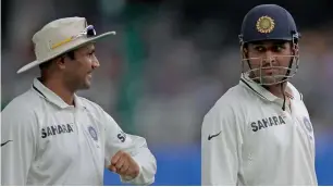  ?? Getty Images file ?? Virender Sehwag (left) has advised MS Dhoni to play his natural aggressive game. —