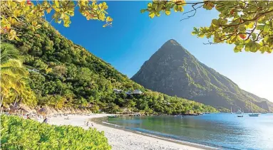  ?? Y TT E G ?? Awe-inspiring: The Pitons in St Lucia, which is open to British tourists this winter