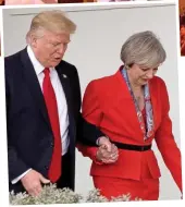  ??  ?? Hand in hand: Trump and Mrs May