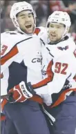  ?? Jay LaPrete/Associated Press ?? Washington’s Tom Wilson, left, celebrates his goal with Evgeny Kuznetsov.