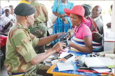  ?? (Picture by Alec Mubani) ?? Zimbabwe National Army senior nurse Major Joshua Madzivanyi­ka takes the blood pressure of a patient at Tongogara Barracks in Harare yesterday as part of the build-up to Zimbabwe Defence Forces Day on Tuesday.