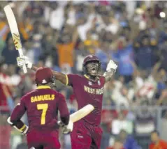  ?? ?? West Indies batsmen Marlon Samuels (left) and Carlos Brathwaite celebrate victory over England in the 2016 ICC Twenty20 World Cup final in India.