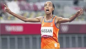  ?? MATTHIAS SCHRADER — THE ASSOCIATED PRESS ?? Sifan Hassan, of the Netherland­s, celebrates after winning the gold medal in the women’s 5,000-meter final Monday.