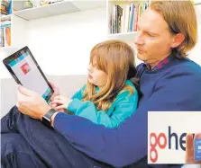  ?? PHOTOS BY KELVIN CHAN ASSOCIATED PRESs ?? LEFT: Paddy Kelly of London and his daughter, Ailish, use gohenry, one of a wave of digital banking apps for children. BELOW: Alex Zivoder, CEO of gohenry, displays a sample of the prepaid debit cards that the app comes with.