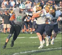  ?? RANDY MEYERS — FOR THE MORNING JOURNAL ?? Columbia quarterbac­k Jared Bycznski has his facemask grabbed by Kirtland’s Jake Neibecker for a penalty as he runs on Aug. 31, 2018.