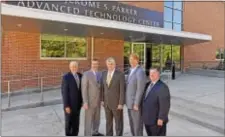  ??  ?? Guests come together in front of the Jerome S. Parker Advanced Technology Center in honor of its namesake, former DCCC president Jerome S. Parker. Pictured are Gary Smith, president/CEO of the Chester County Economic Developmen­t Council; college...