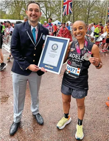  ?? ?? Southport’s Radio 1 DJ and cancer awareness champion Adele Roberts has set a new Guinness World Record at the 2023 London Marathon