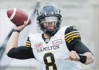  ?? GRAHAM HUGHES
THE CANADIAN PRESS ?? Ticats starter Jeremiah Masoli went the distance in Calgary, completing 25-of-36 passes for 344 yards and an intercepti­on. He will return under centre Friday night when Hamilton visits the Edmonton Eskimos.