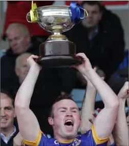  ??  ?? The moment the good folk of Gusserane have been waiting for since 1975 as Graeme Cullen raises the Wexford Creamery Cup aloft in triumph.