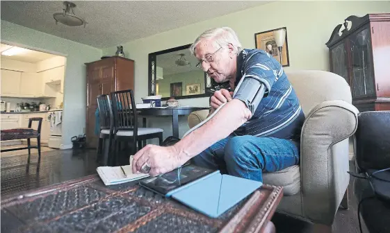  ??  ?? John Scully checks his blood pressure at home. The 80-year-old has become an advocate for medical assistance in dying (MAID) on the sole basis of mental illness. “I have a human right to have the same rights of treatment as a person with a physical illness, including MAID,” he says.