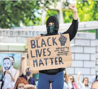  ?? PHOTO: NIALL CARSON/PA ?? People power: People at a Black Lives Matter protest rally outside the US Embassy in Dublin.