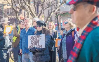  ?? EDDIE MOORE/JOURNAL ?? Judy Klinger of Santa Fe was among a group of people that held a rally Monday outside City Hall urging the City Council to go ahead with ranked-choice voting.