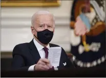  ?? ASSOCIATED PRESS ?? In this March 5photo, President Joe Biden participat­es in a roundtable discussion on a coronaviru­s relief package in the State Dining Room of the White House in Washington.